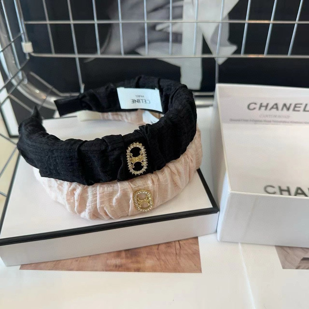 BLACK FABRIC WITH GOLD LOGO HAIRBAND 414448