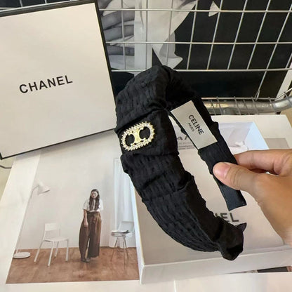 BLACK FABRIC WITH GOLD LOGO HAIRBAND 414448