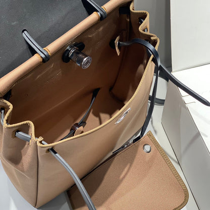 HERBAG A DOS ZIP RETOURNE BACKPACK 29 IN BROWN CANVAS AND BLACK CALFSKIN