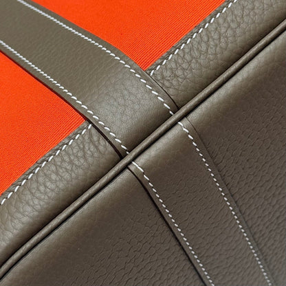 GARDEN PARTY 30CM IN ORANGE MINIMUM TOILETS COTTON CANVAS AND BROWN CALFSKIN