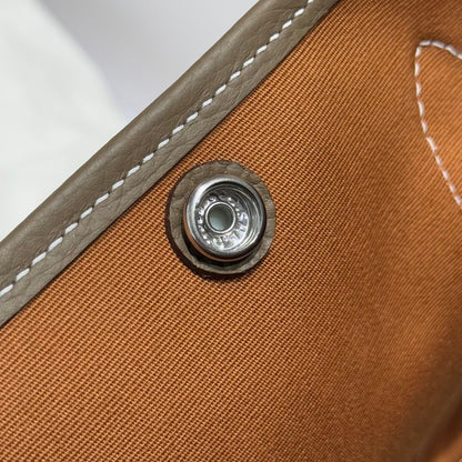 GARDEN PARTY 30CM IN BROWN TOILETS COTTON CANVAS AND TOGO ETOUPE CALFSKIN