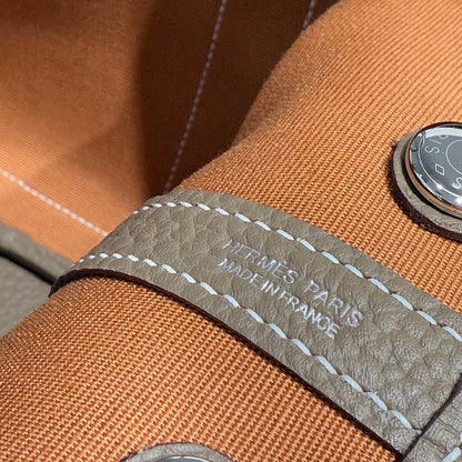 GARDEN PARTY 30CM IN BROWN TOILETS COTTON CANVAS AND TOGO ETOUPE CALFSKIN