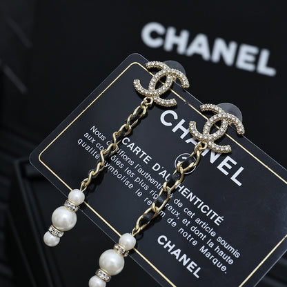 DOUBLE C CHAIN DETAIL EARRINGS IN GOLD METAL WITH LAMBSKIN TASSEL PEARL AND CRYSTAL LOGO