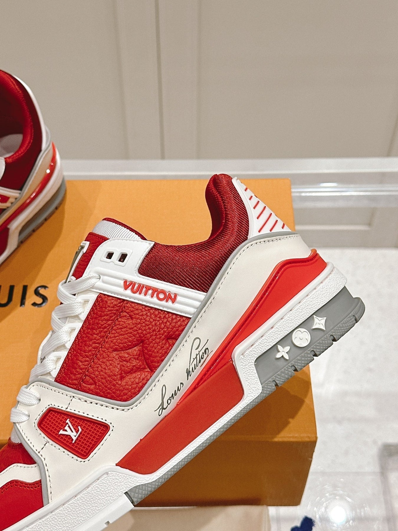 LV TRAINER SNEAKER IN SARI RED GRAINED CALFSKIN