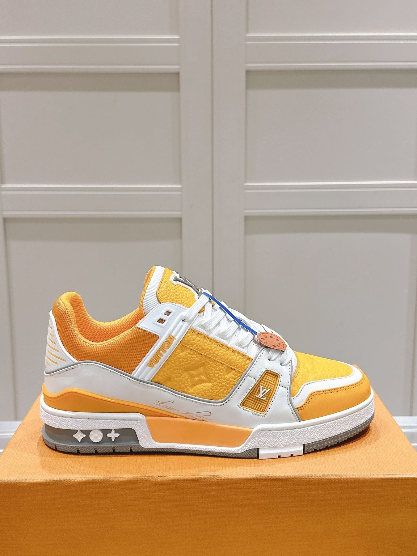 LV TRAINER SNEAKER IN SAFFRAN YELLOW GRAINED CALFSKIN