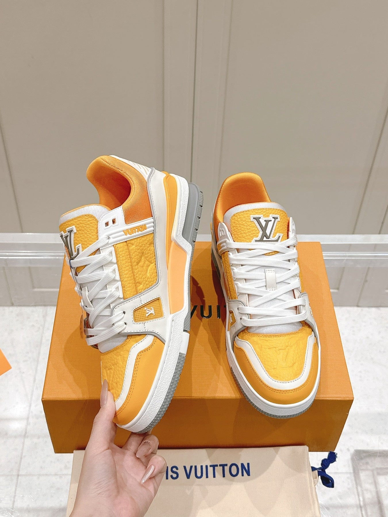 LV TRAINER SNEAKER IN SAFFRAN YELLOW GRAINED CALFSKIN
