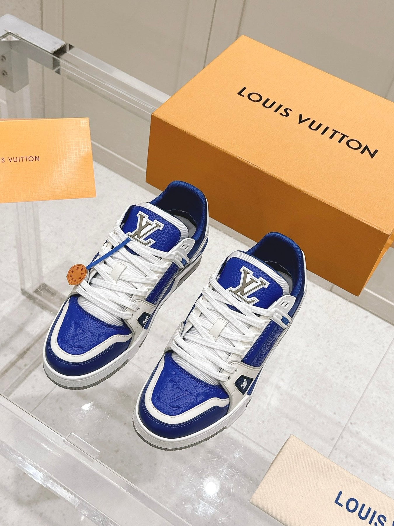 LV TRAINER SNEAKER IN GASTON BLUE GRAINED CALFSKIN