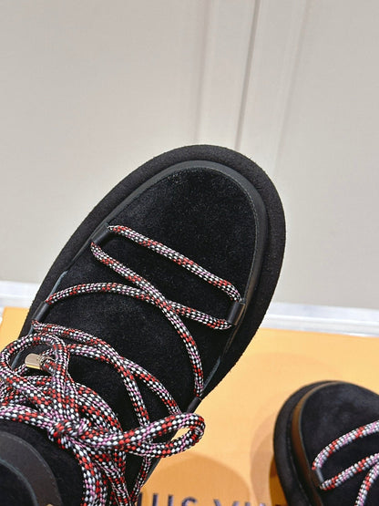 ASPEN PLATFORM ANKLE BOOT IN BLACK MONOGRAM DEBOSSED SUEDE AND SHEARLING