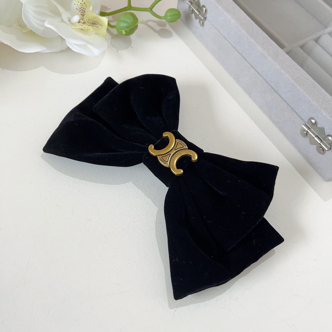 BLACK VELVET WITH GOLD LOGO HAIRPIN 387059
