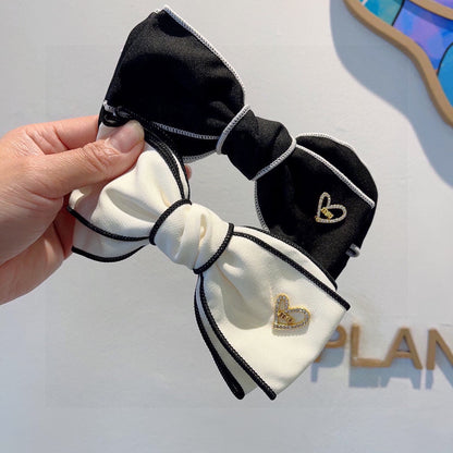 BOW HAIRPIN IN BLACK AND WHITE TRIM COTTON 406022
