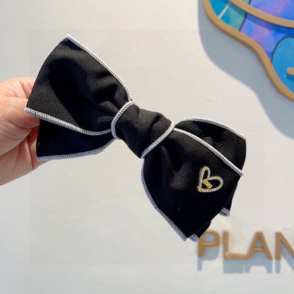 BOW HAIRPIN IN BLACK AND WHITE TRIM COTTON 406022