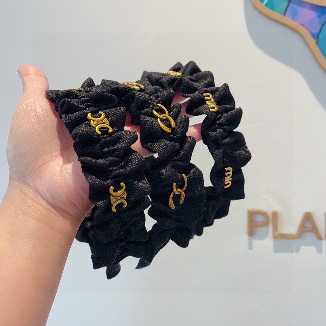 BLACK FABRIC WITH GOLD LOGO HAIRBAND 415931