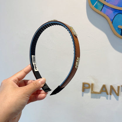 HEAD BAND IN BURNT ORANGE LAMBSKIN AND RESIN 417296