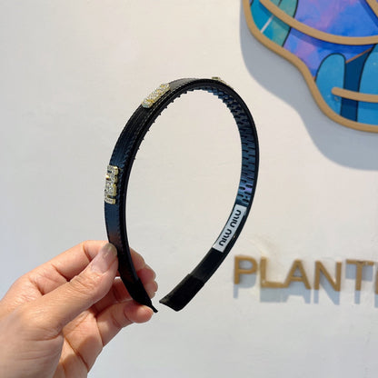 HEAD BAND IN BLACK LAMBSKIN AND RESIN 417299