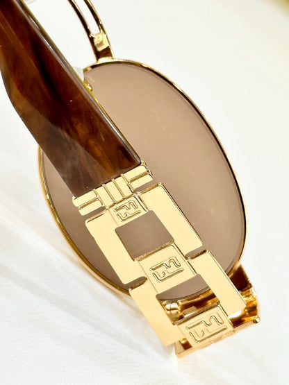 FIRST CRYSTAL OVAL FRAME SUNGLASSES 7076 IN METAL