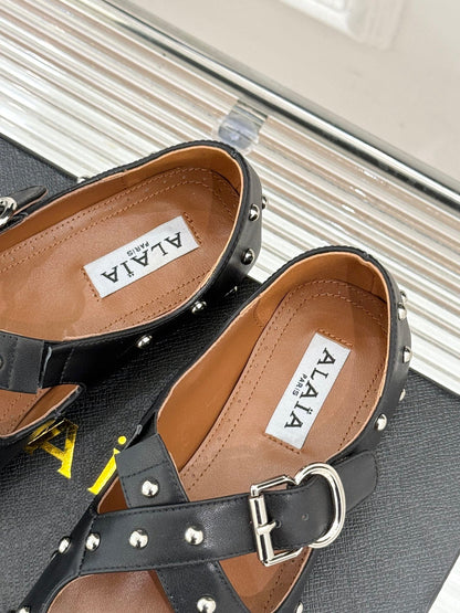 CROSSED STRAP BALLET FLATS IN BLACK CALFSKIN