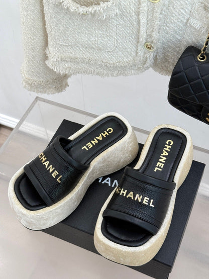 PLATFORM SLIPPERS IN BLACK LAMBSKIN