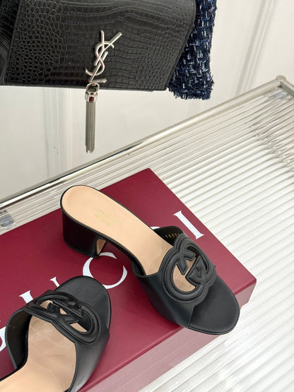 MID-HEEL MULE IN BLACK CALFSKIN