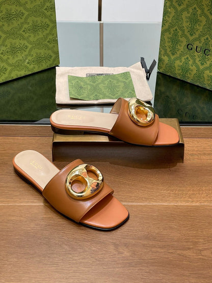 FLAT MULE IN BRONE BROWN CALFSKIN WITH GOLD HARDWARE