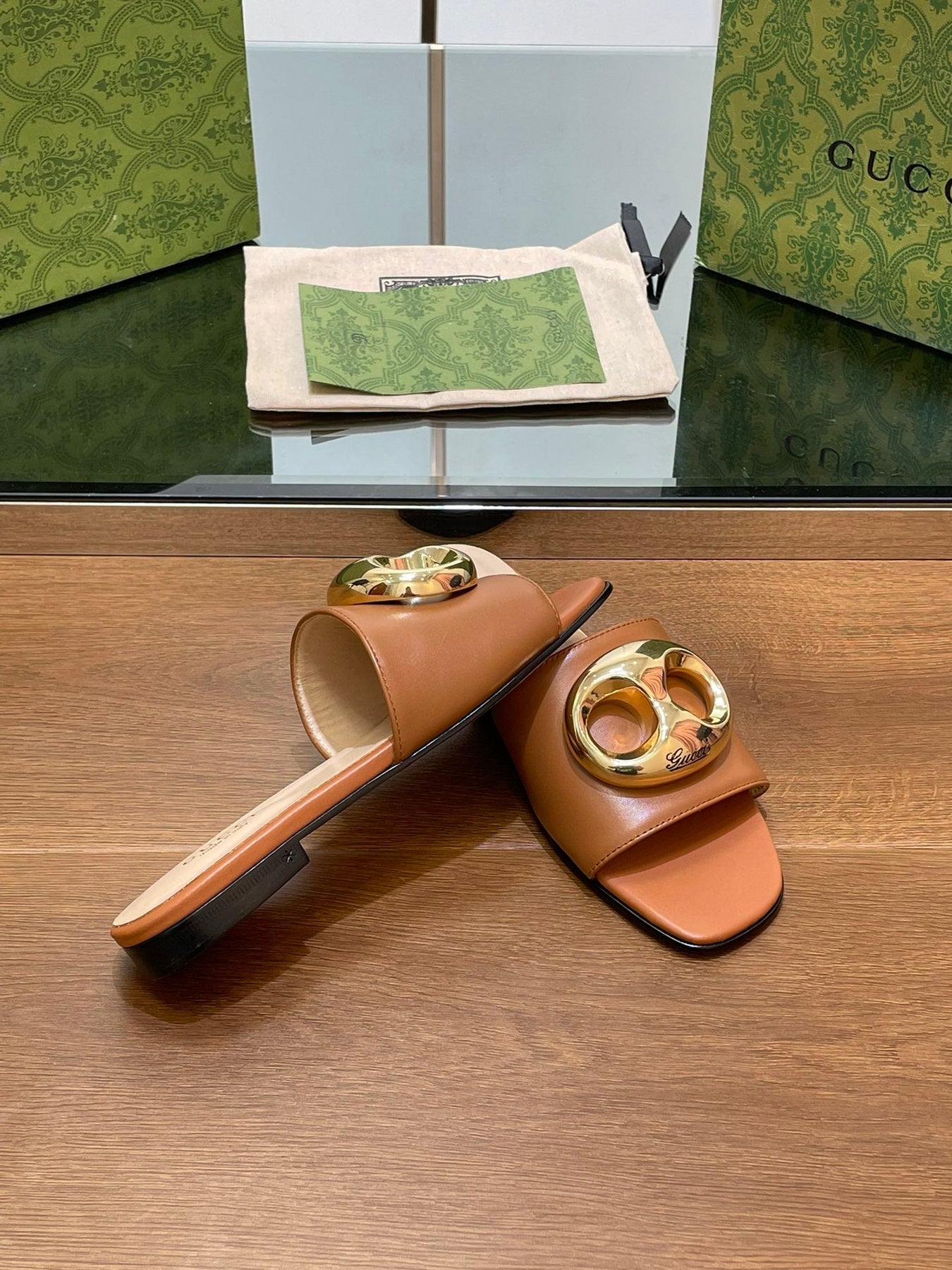 FLAT MULE IN BRONE BROWN CALFSKIN WITH GOLD HARDWARE