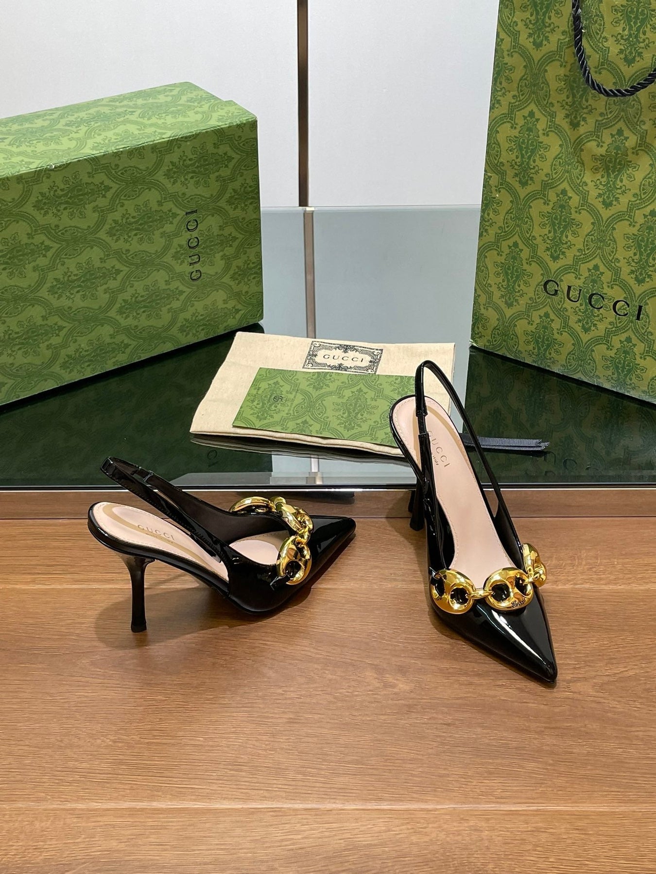GG HIGH SLINGBACK 10.5 CM IN BLACK GLOSSY CALFSKIN WITH GOLD HARDWARE