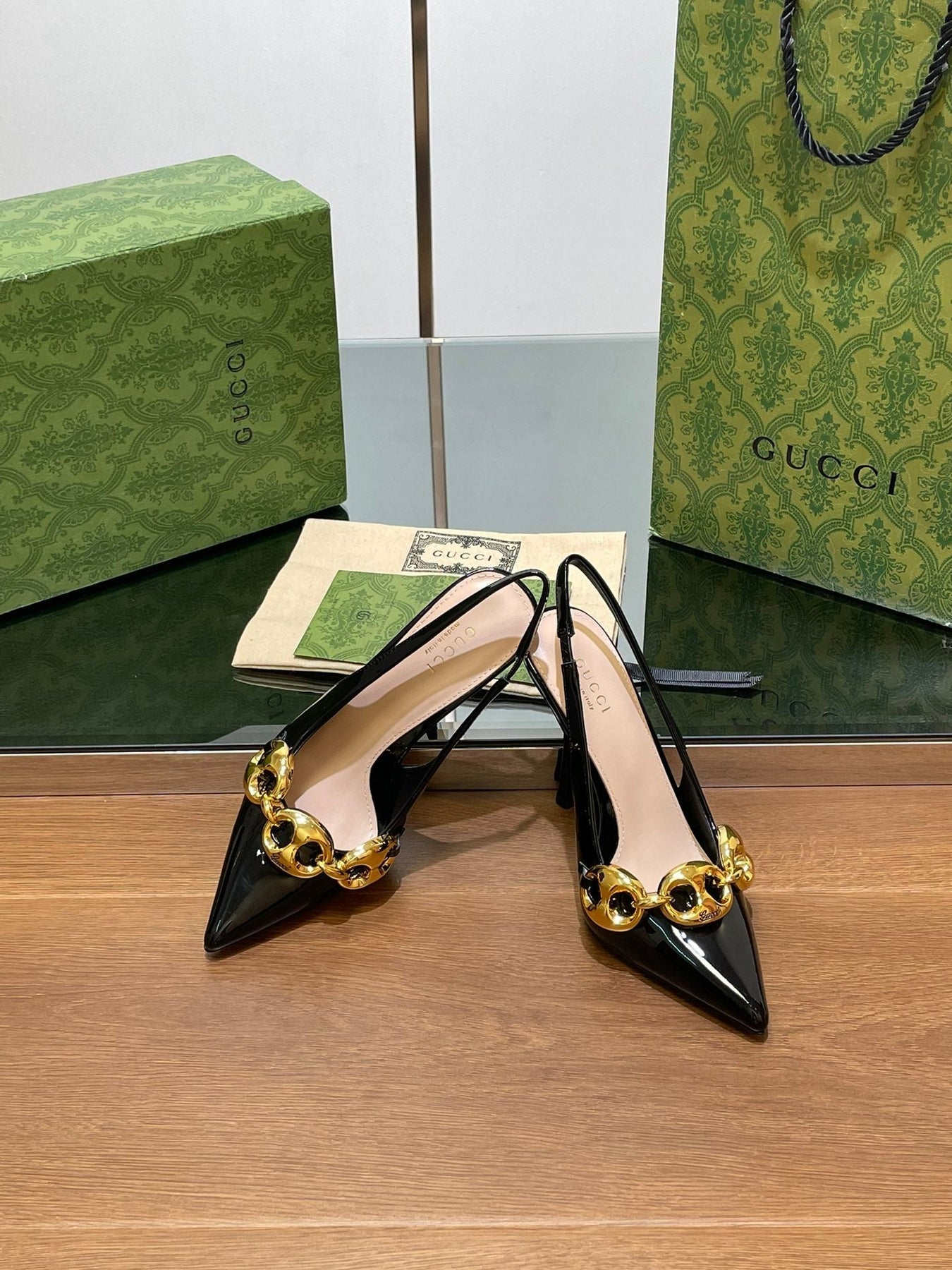 GG HIGH SLINGBACK 10.5 CM IN BLACK GLOSSY CALFSKIN WITH GOLD HARDWARE