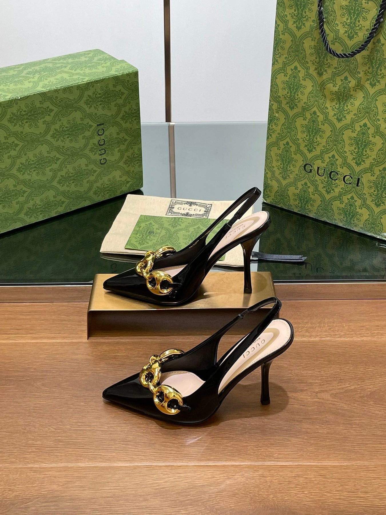 GG HIGH SLINGBACK 10.5 CM IN BLACK GLOSSY CALFSKIN WITH GOLD HARDWARE