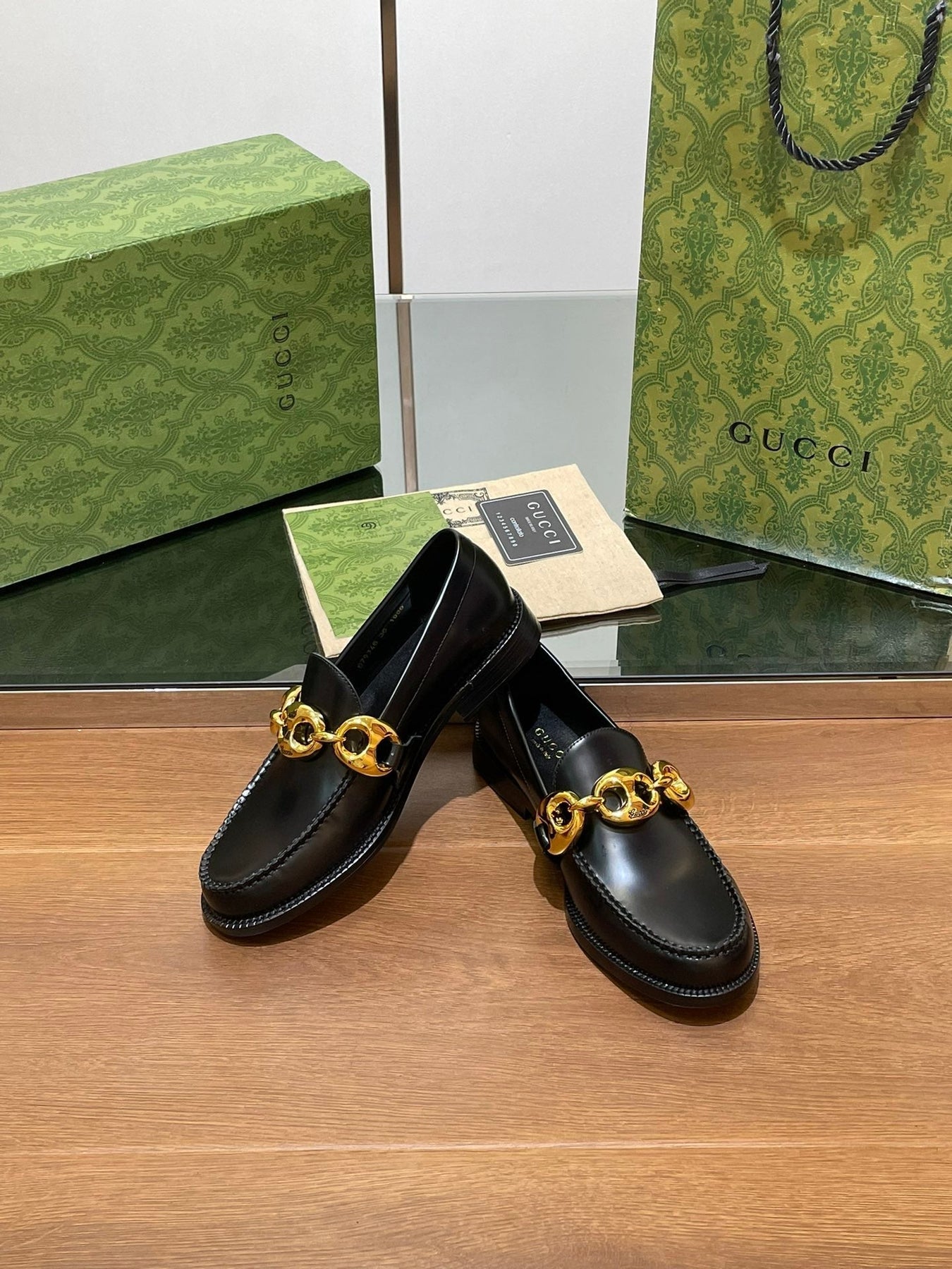 GG LOAFER SHOES IN BLACK CALFSKIN WITH GOLD HARDWARE