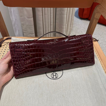KELLY CUT 31 IN SANGRIA PURPLE ALLIGATOR LEATHER WITH GOLD HARDWARE