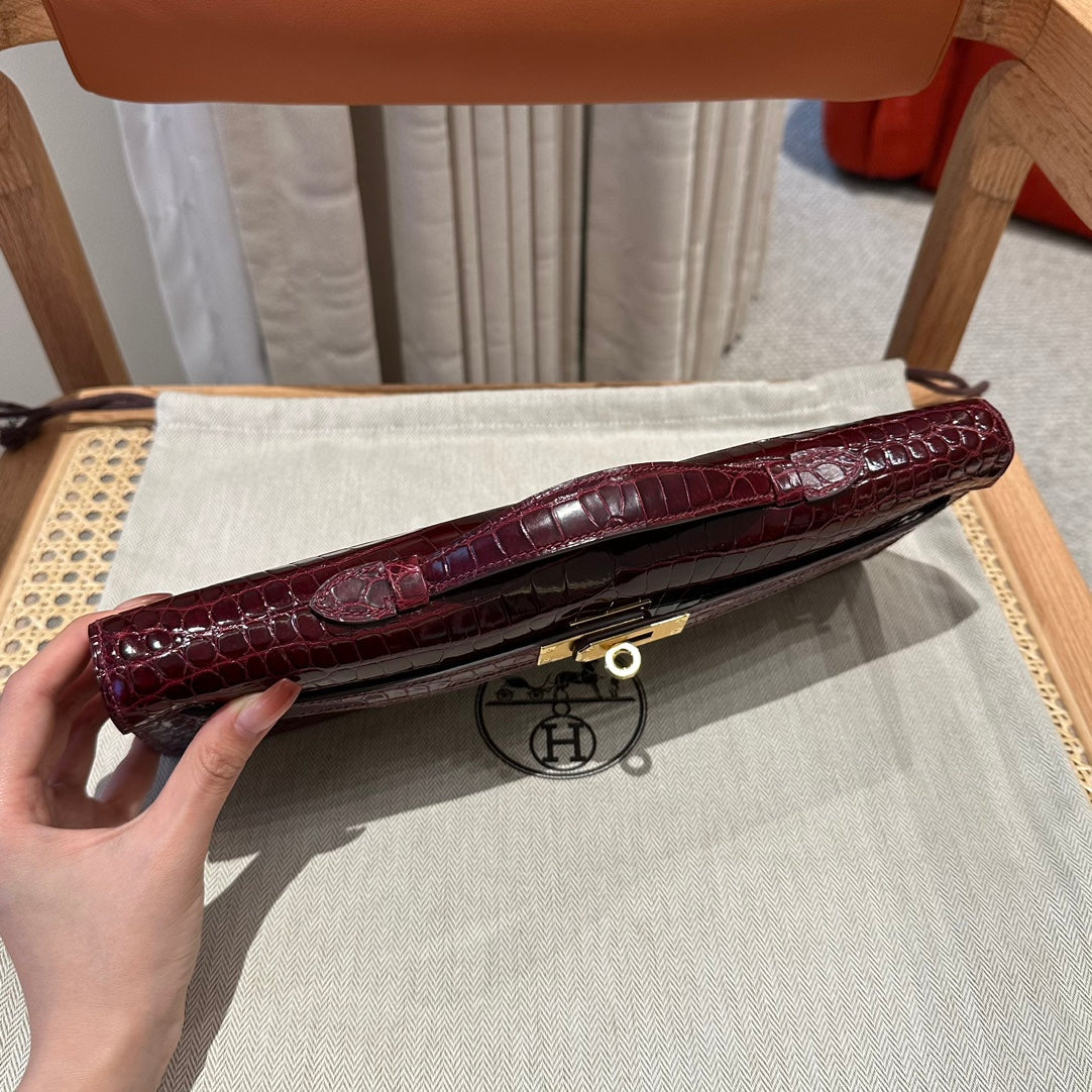 KELLY CUT 31 IN SANGRIA PURPLE ALLIGATOR LEATHER WITH GOLD HARDWARE