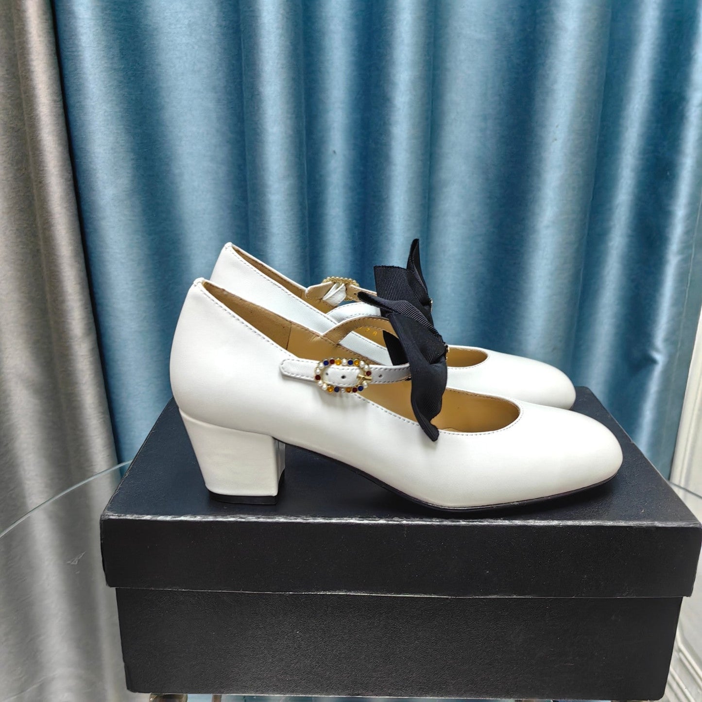 HIGH MARY JANE SHOES WHITE SHEEPSKIN WITH BLACK BOW