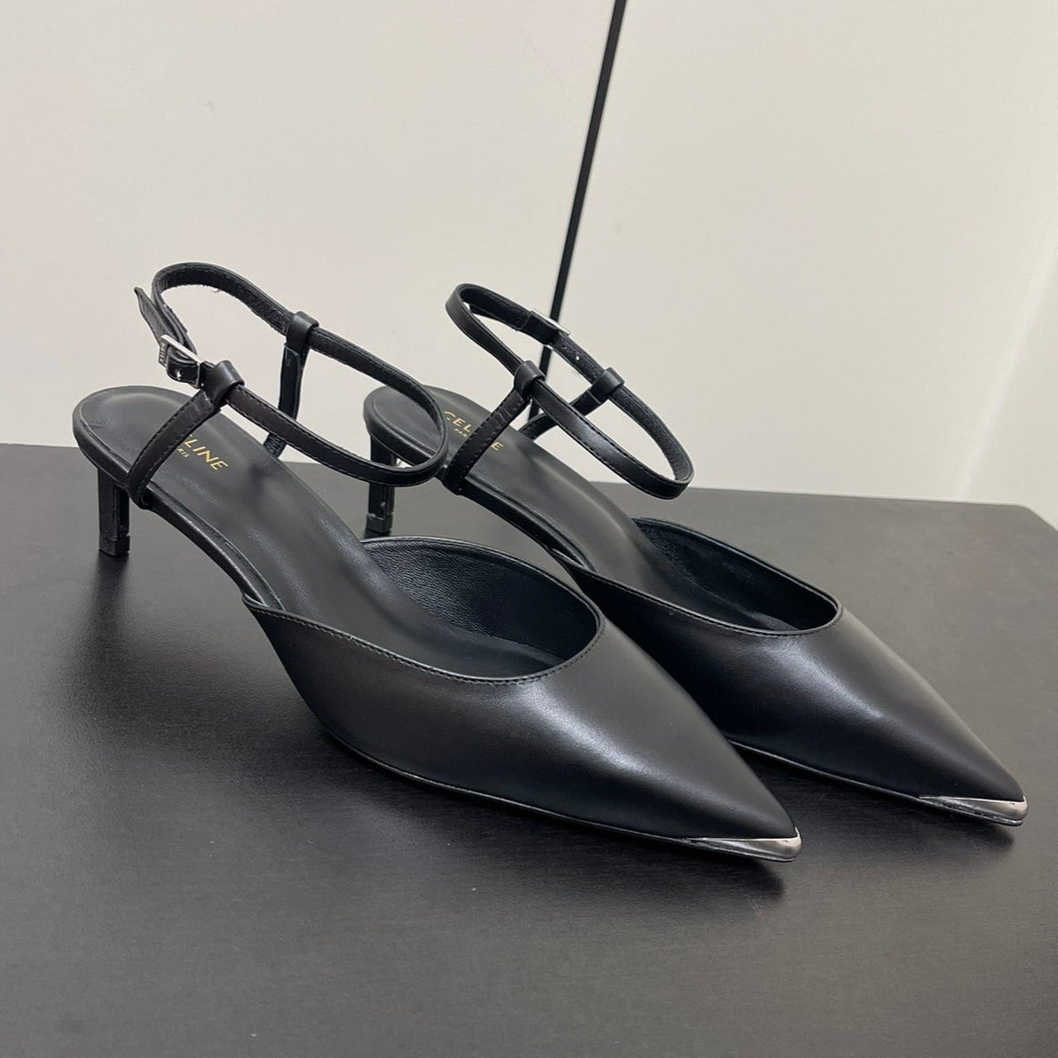 MORRAINE SLINGBACK PUMPS IN BLACK CALFSKIN