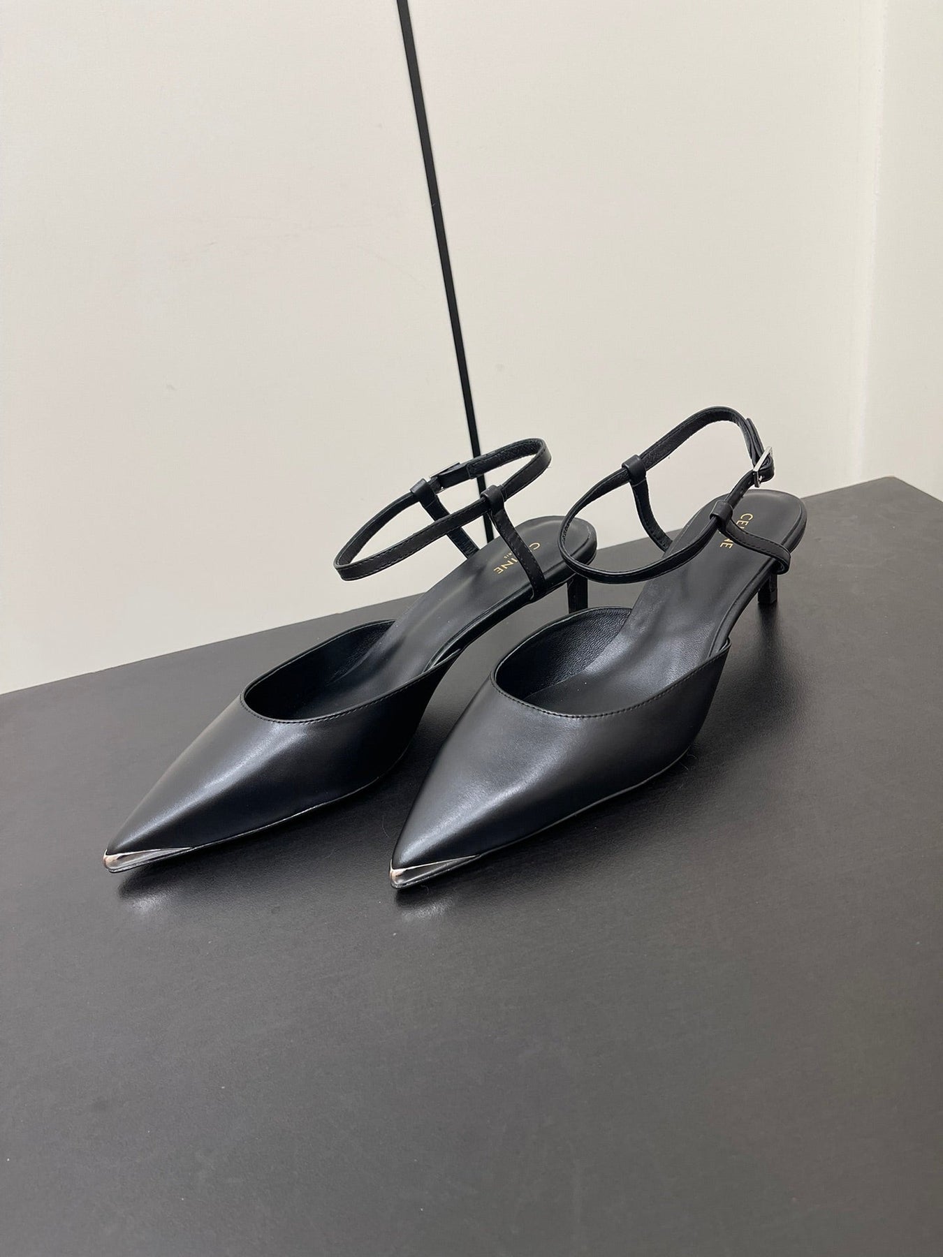 MORRAINE SLINGBACK PUMPS IN BLACK CALFSKIN