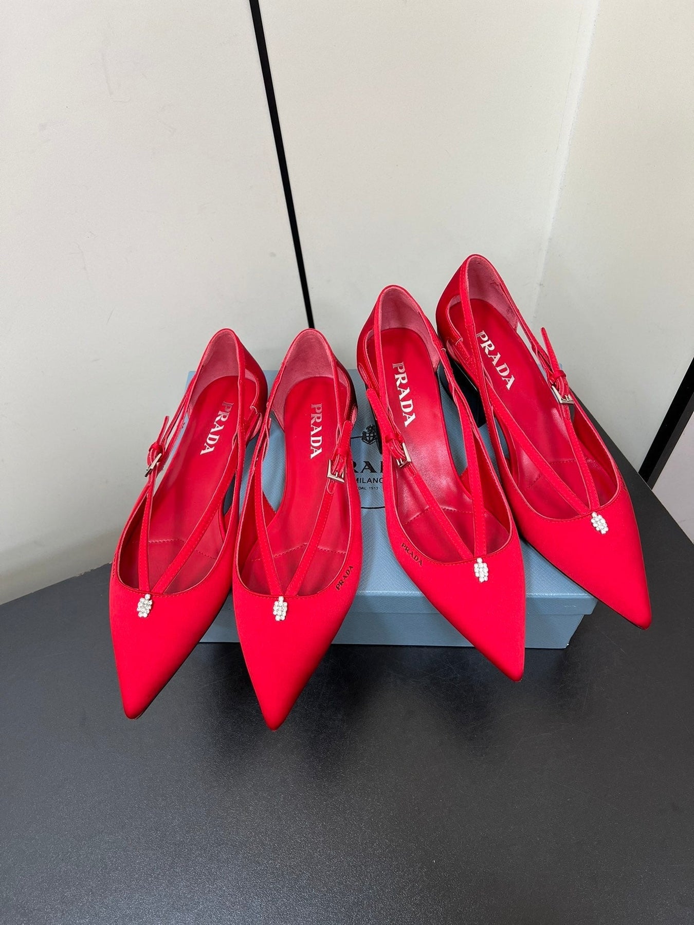 CUT-OUT PUMPS WITH BEAD BUCKLE IN CLASSIC RED SATIN