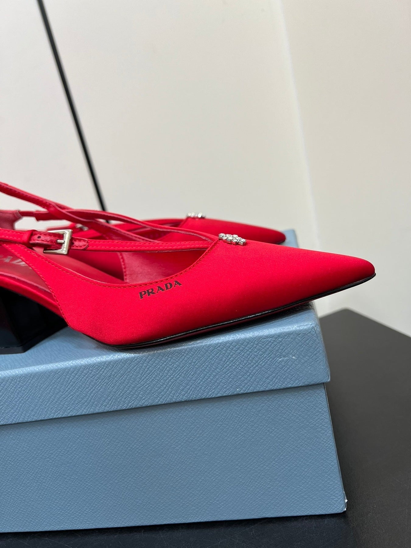 CUT-OUT PUMPS WITH BEAD BUCKLE IN CLASSIC RED SATIN