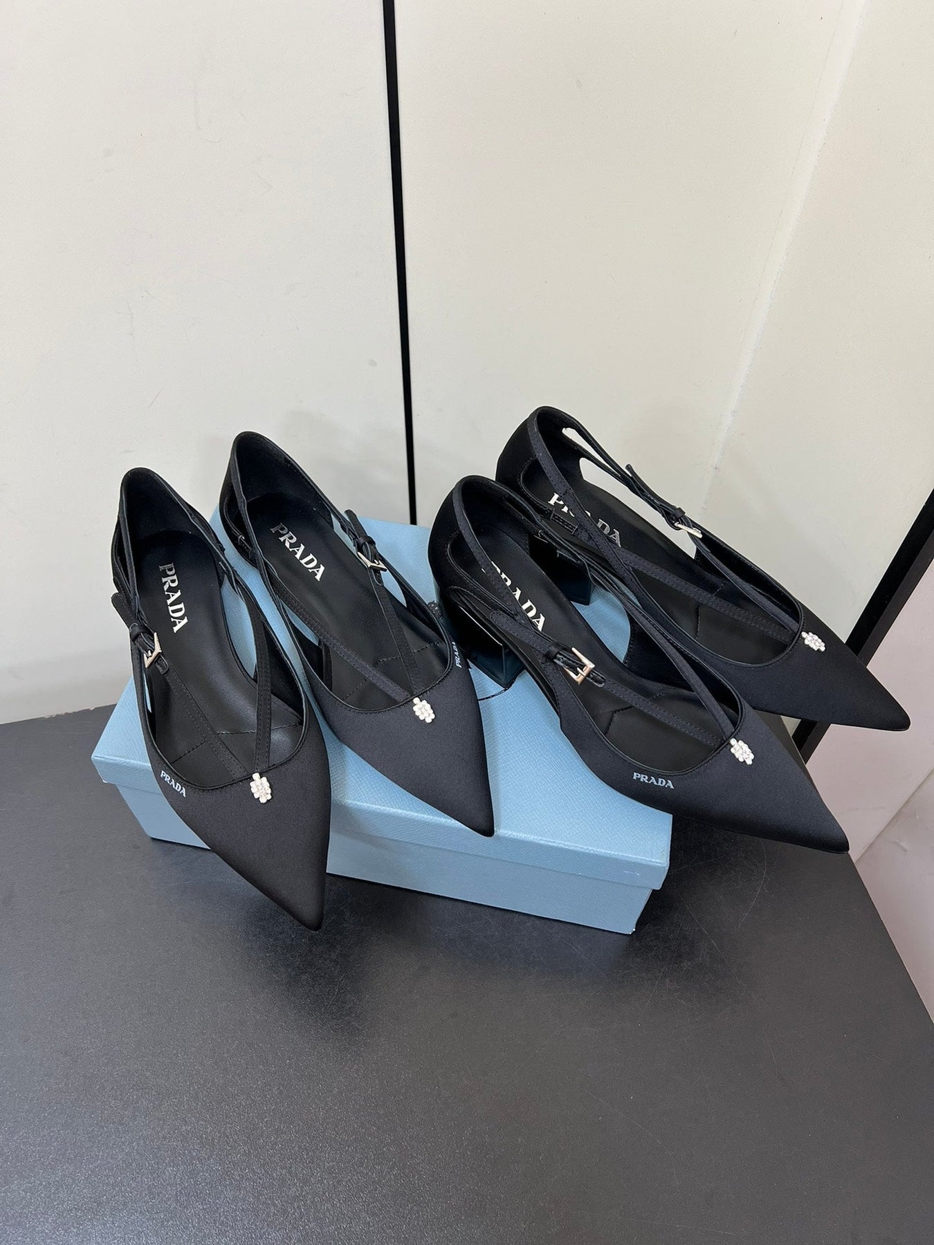 CUT-OUT PUMPS WITH BEAD BUCKLE IN BLACK SATIN