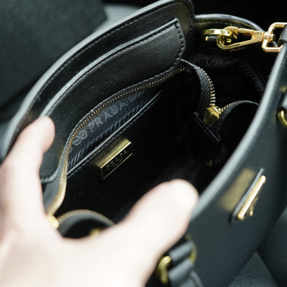 RE-EDITION TOP HANDLE BAG 20 IN BLACK CALFSKIN