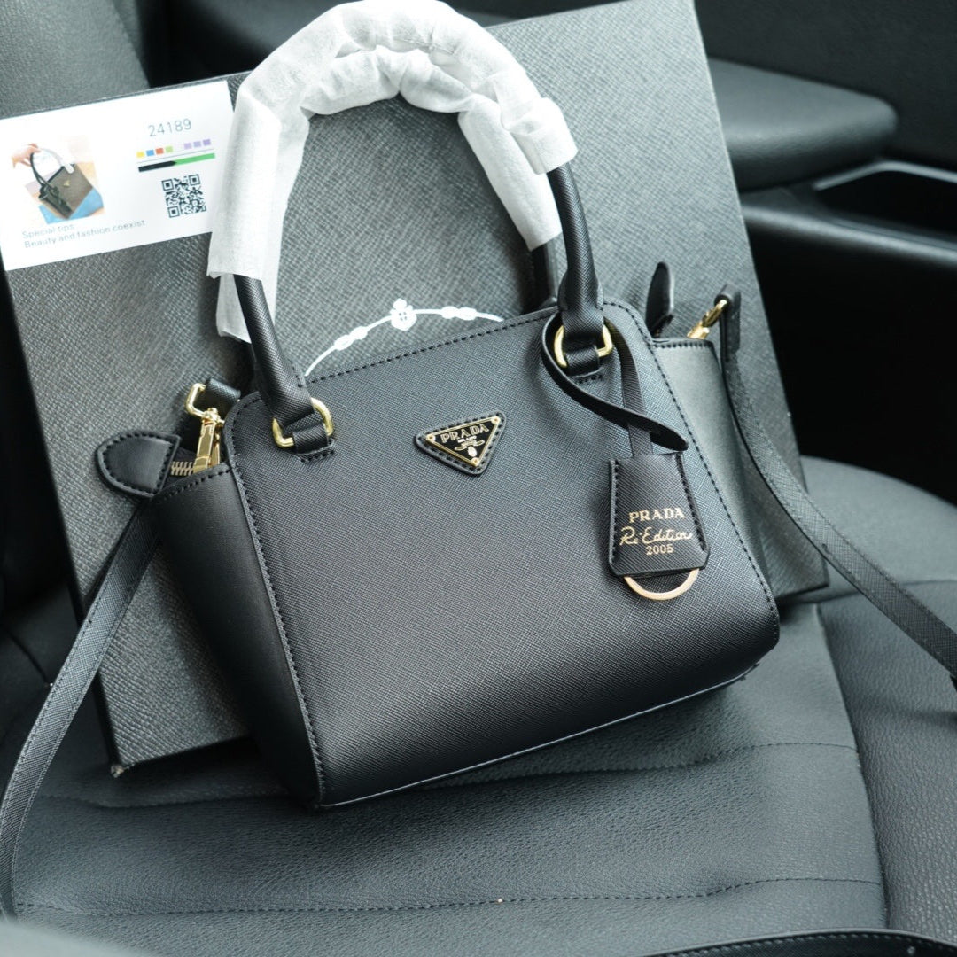 RE-EDITION TOP HANDLE BAG 20 IN BLACK CALFSKIN