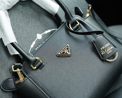 RE-EDITION TOP HANDLE BAG 20 IN BLACK CALFSKIN