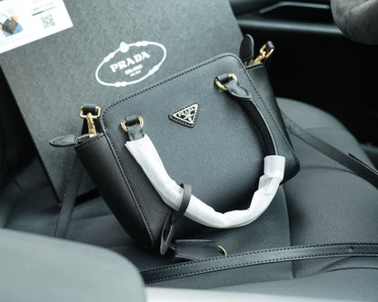 RE-EDITION TOP HANDLE BAG 20 IN BLACK CALFSKIN