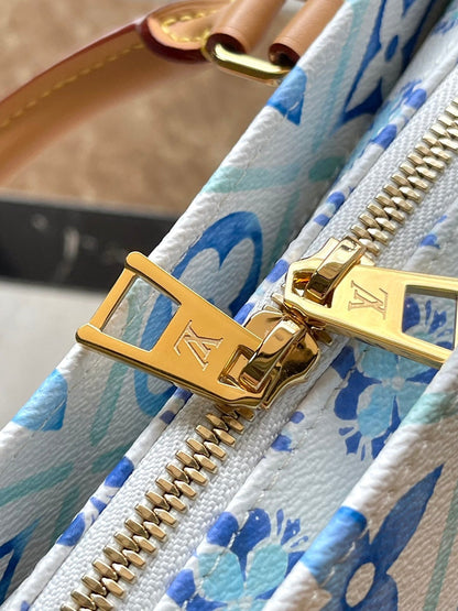 ONTHEGO EAST WEST 25 IN LAGOON BLUE MONOGRAM TILES CANVAS