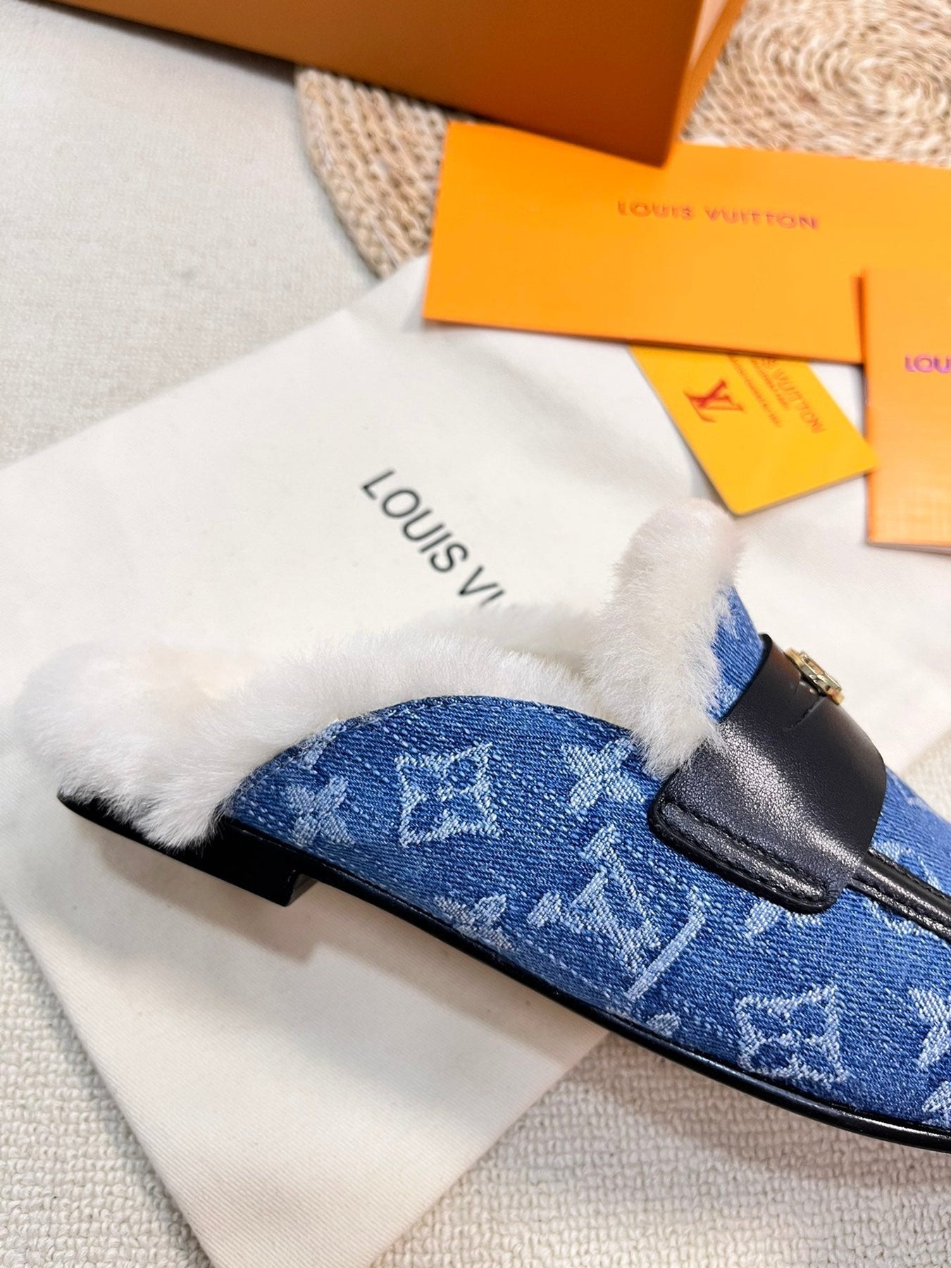 FLAT MULE IN COBALT BLUE MONOGRAM DENIM AND SHEARLING LINING