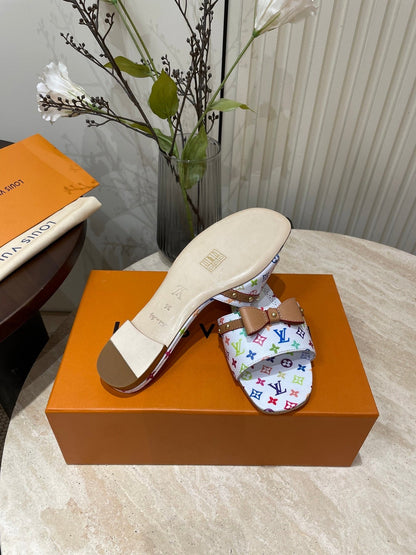 FLAT MULES IN WHITE MONOGRAM LAMBSKIN