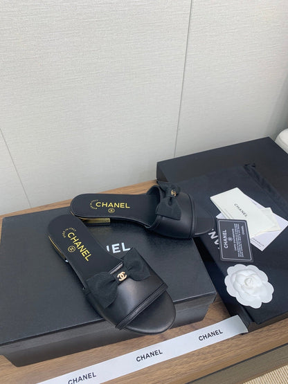 BOW SLIPPERS IN BLACK LAMBSKIN