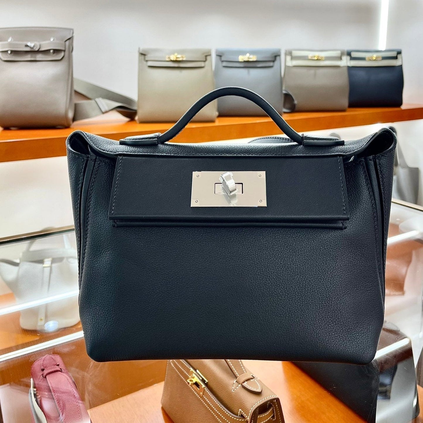 MINI 24/24 21CM IN BLACK EVERCOLOR CALFSKIN SILVER KELLY BUCKLE