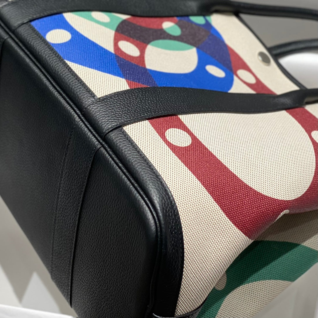 GARDEN PARTY 36 IN MULTICOLOR TOILE H CANVAS BLACK CALFSKIN OVERLAPPING POLKA RINGS PRINT