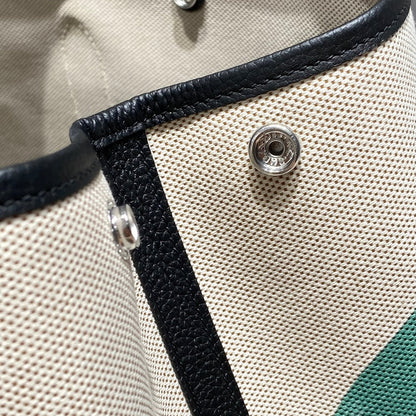 GARDEN PARTY 36 IN MULTICOLOR TOILE H CANVAS BLACK CALFSKIN OVERLAPPING POLKA RINGS PRINT