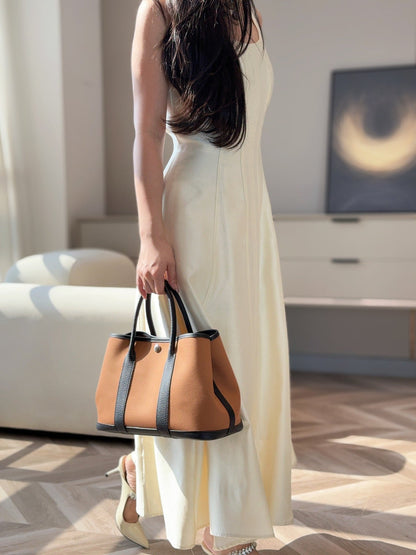 GARDEN PARTY 30CM IN ORANGE MINIMUM TOILETS COTTON CANVAS AND BLACK CALFSKIN