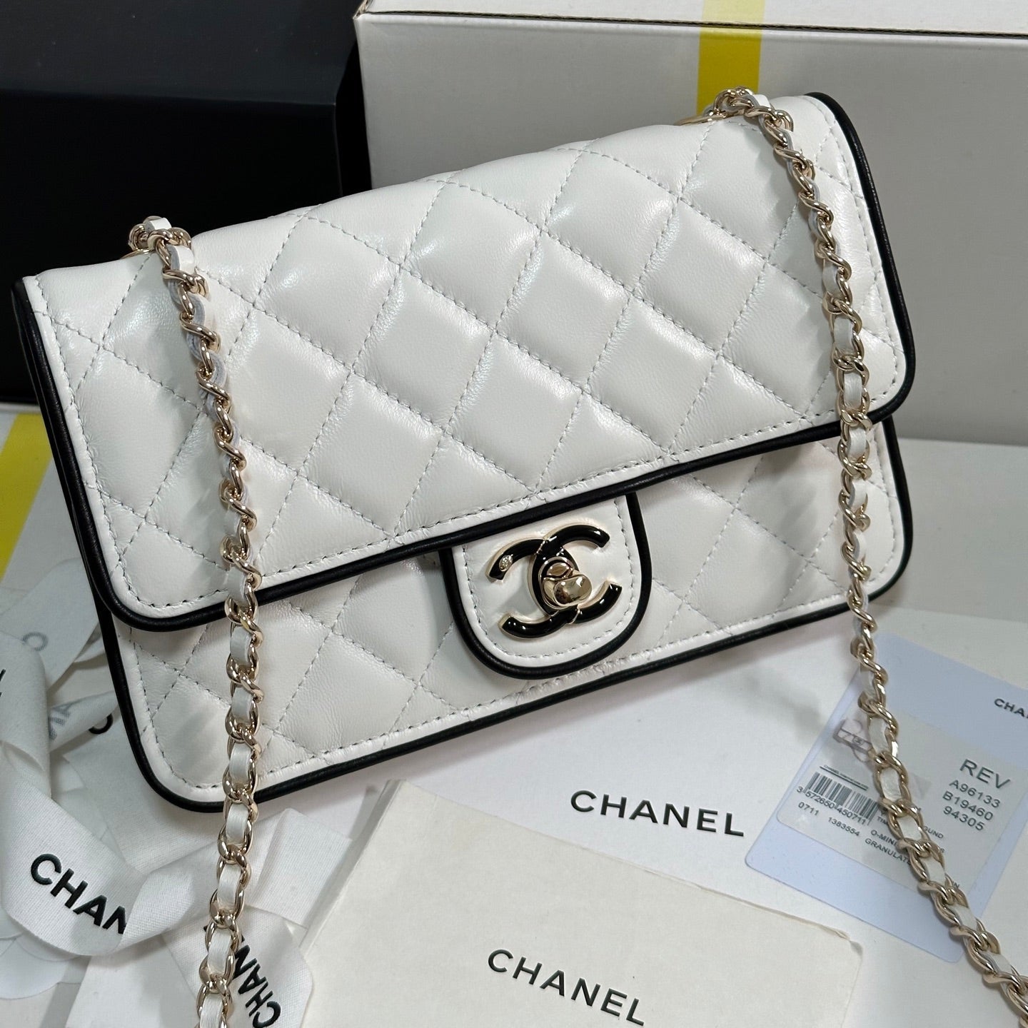 QUILTED FLAP BAG WITH BLACK TRIM 19 IN WHITE LAMBSKIN