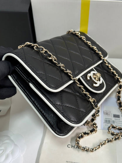 QUILTED FLAP BAG WITH WHITE TRIM 19 IN BLACK LAMBSKIN
